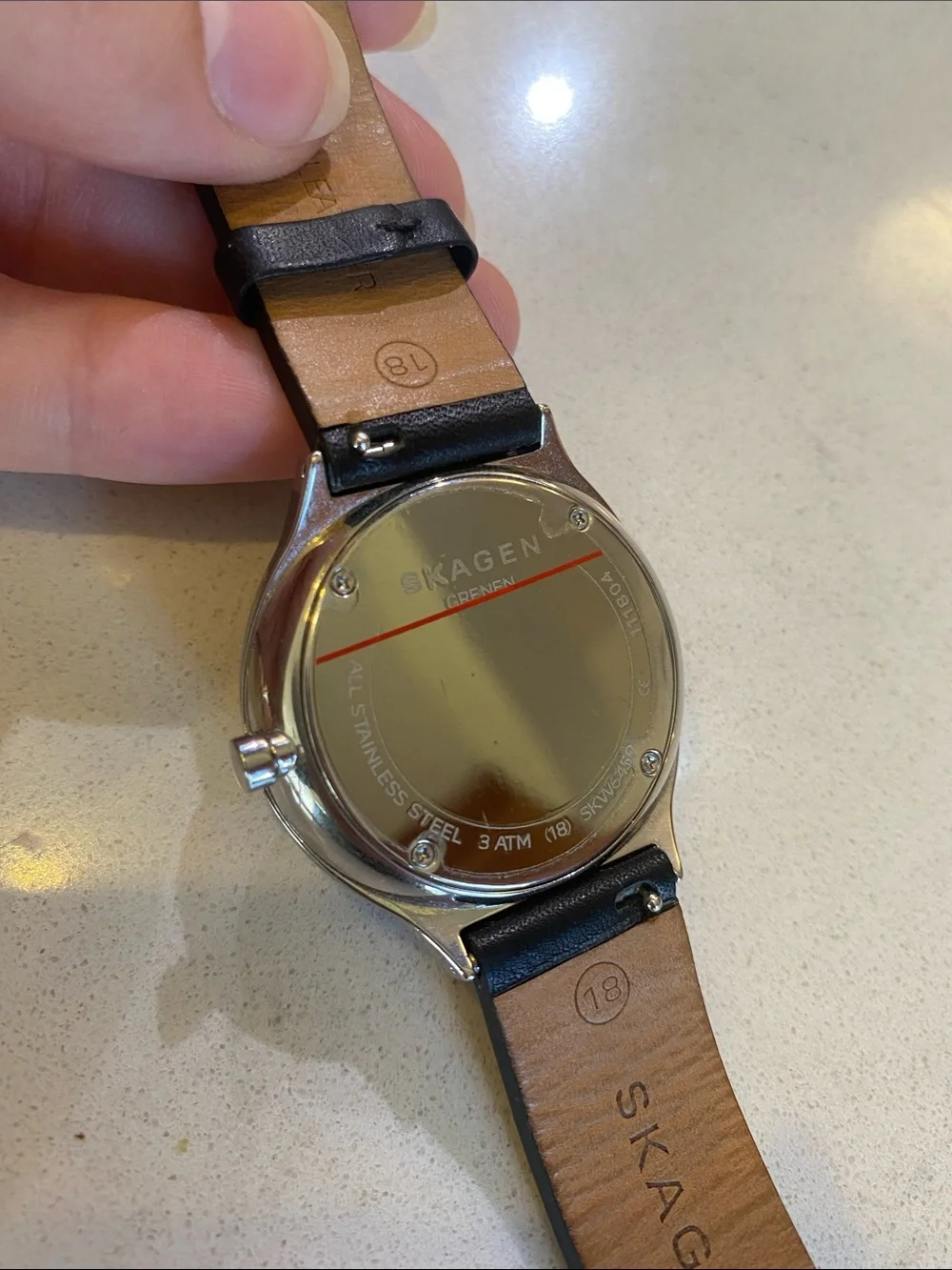 Skagen stainless steel silver watch with a black leather watch band 18